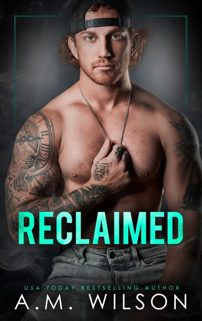 Ebook cover for Reclaimed. Male model wearing a backward ball cap and holding a chain against his bare chest
